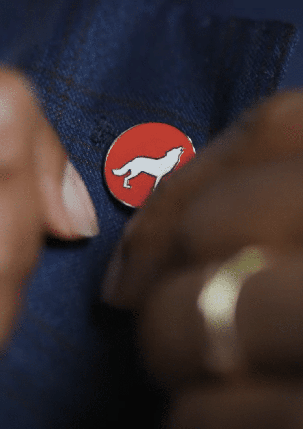 Close-up image of Kevin Howell's lapel pin